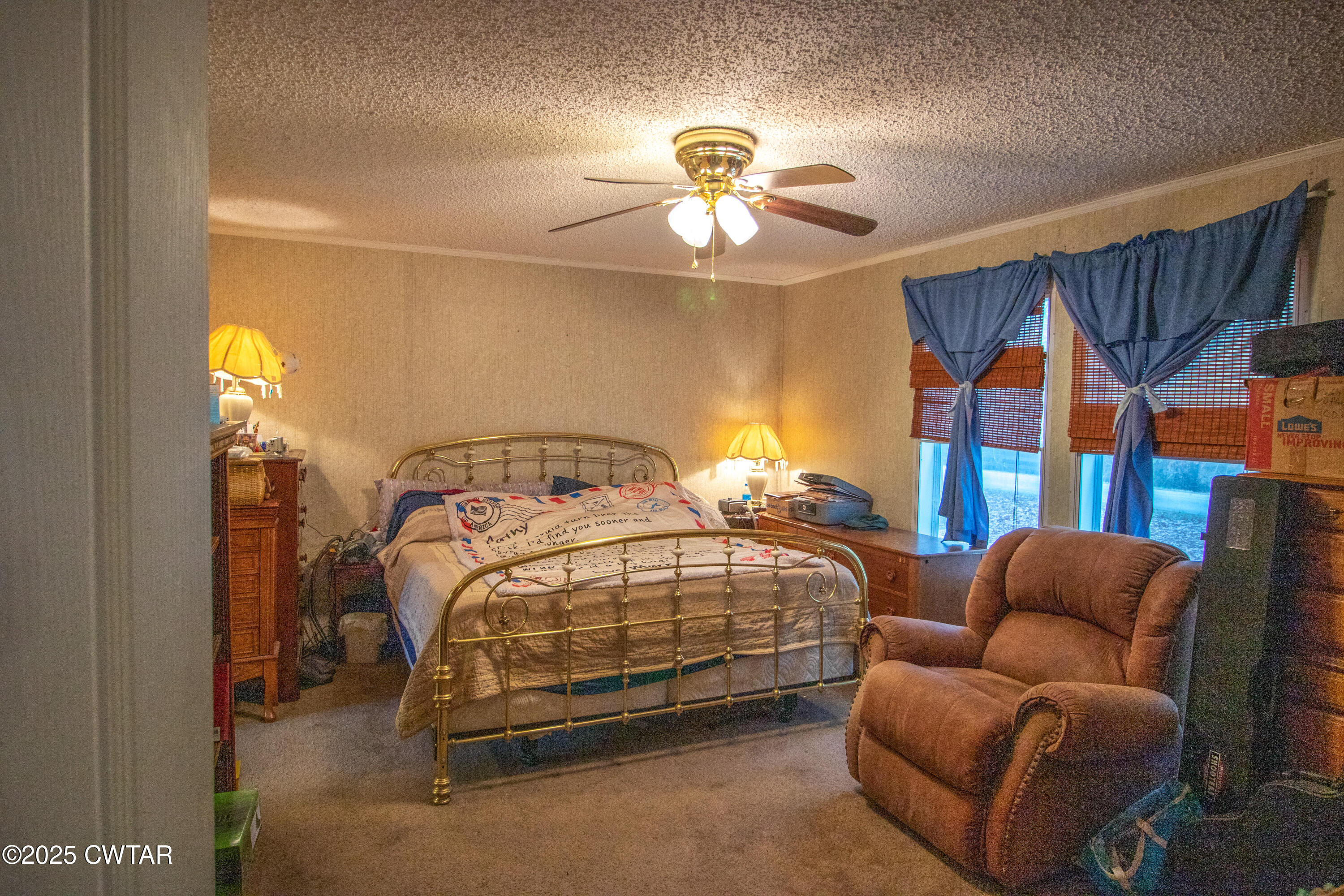 6599 Chestnut Bluff Road Friendship, TN 38034 - Photo 17 of 33 a bedroom with furniture and a chandelier