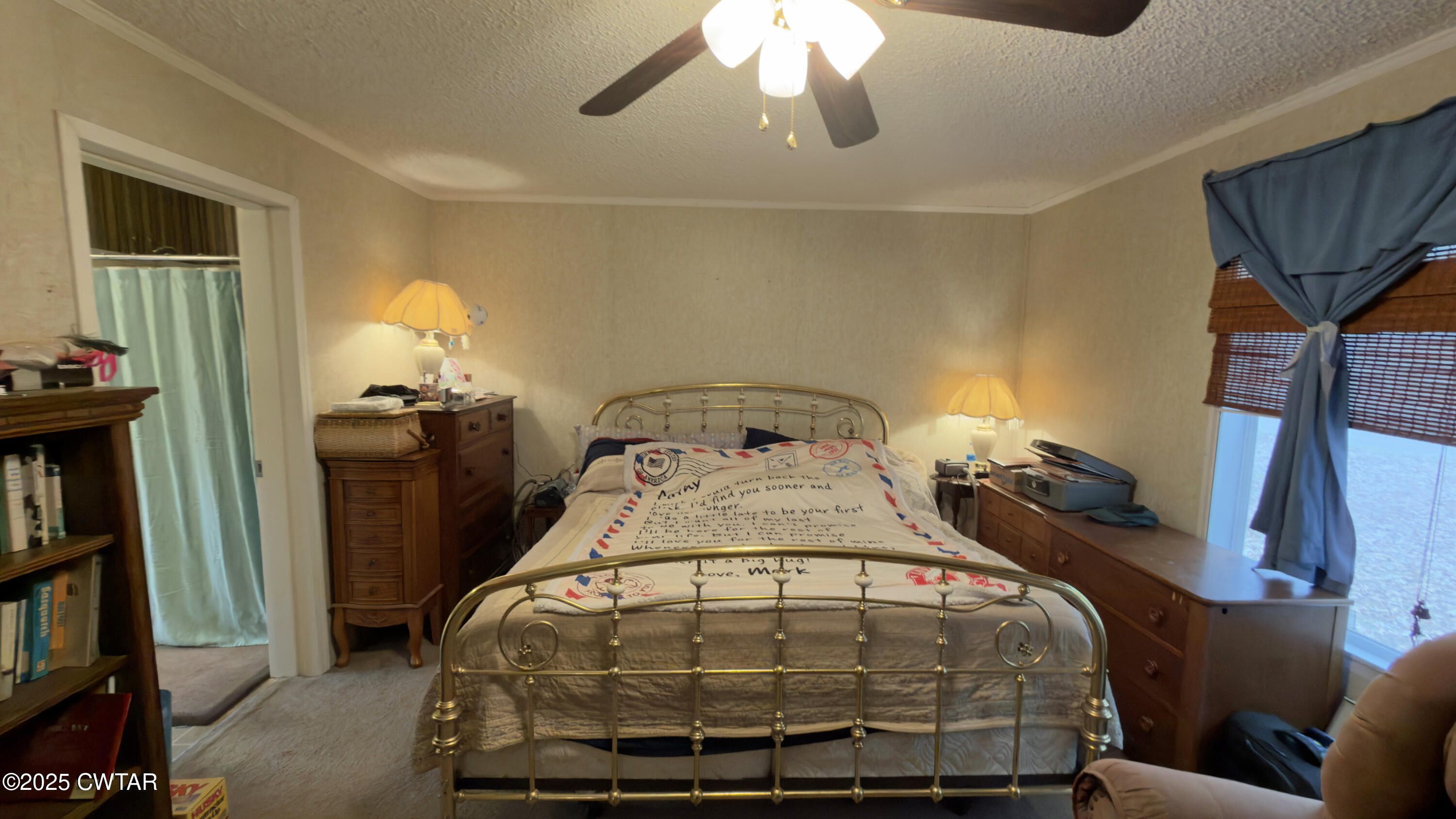 6599 Chestnut Bluff Road Friendship, TN 38034 - Photo 18 of 33 a bed sitting in a bedroom next to a window