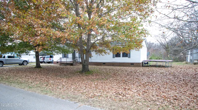 a house with trees in front of it