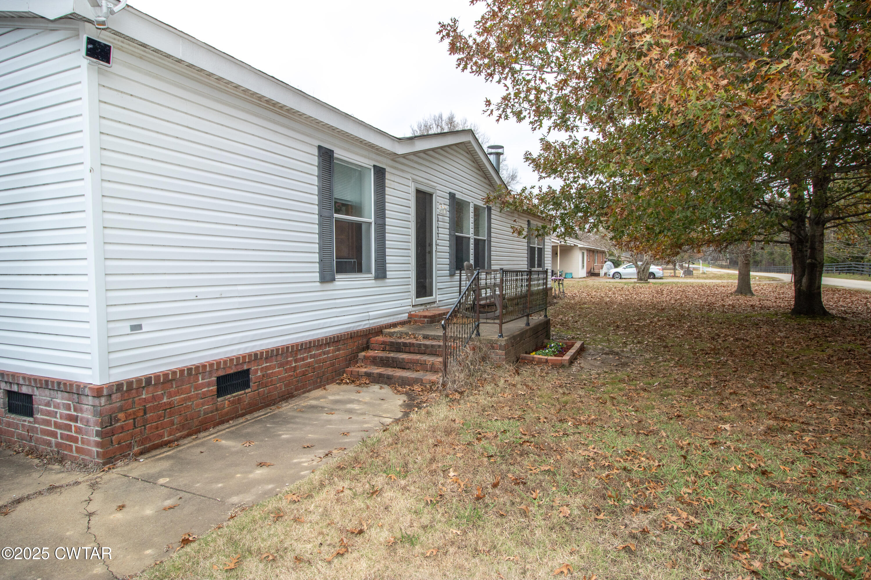 6599 Chestnut Bluff Road Friendship, TN 38034 - Photo 3 of 33 a view of a house with a yard