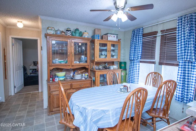a dining room with furniture and chandelier