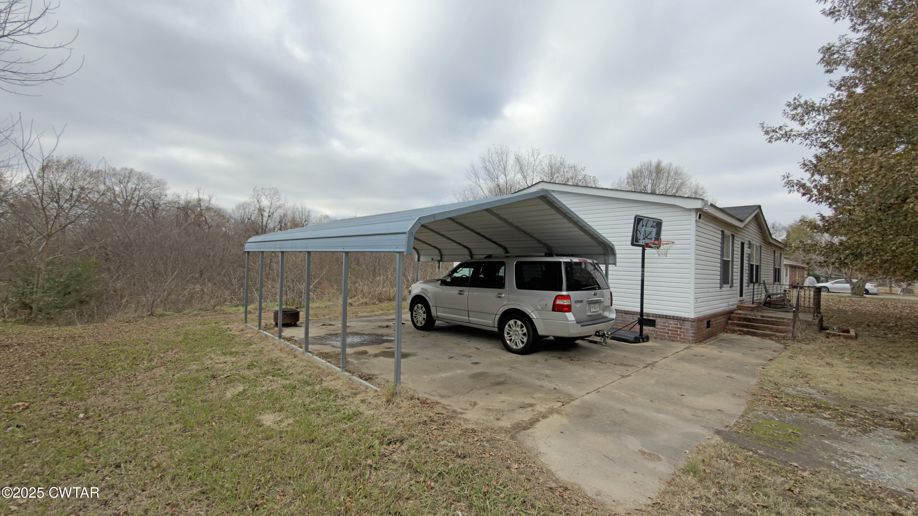 6599 Chestnut Bluff Road Friendship, TN 38034 - Photo 7 of 33 a car parked in front of a house
