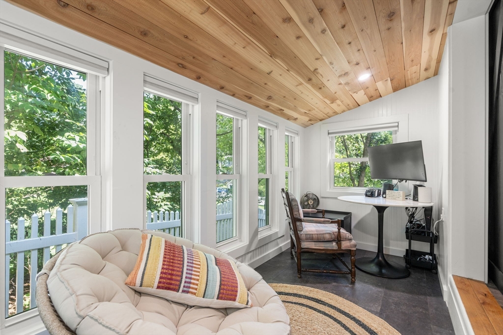 69 Wellesley Rd Extension Natick, MA 01760 - Photo 15 of 30 a living room with furniture and a large window