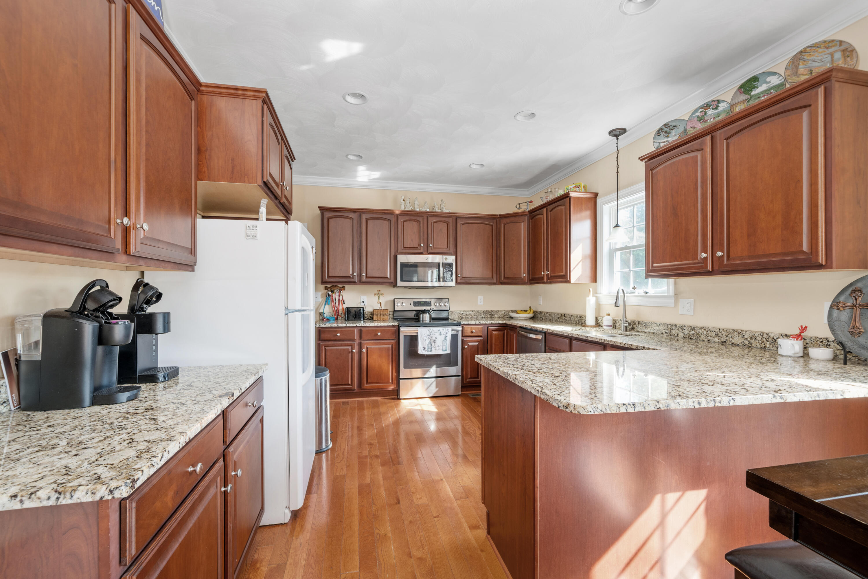 250 Thornblade Way Blue Ridge, VA 24064 - Photo 11 of 31 a kitchen with stainless steel appliances granite countertop a sink stove and refrigerator