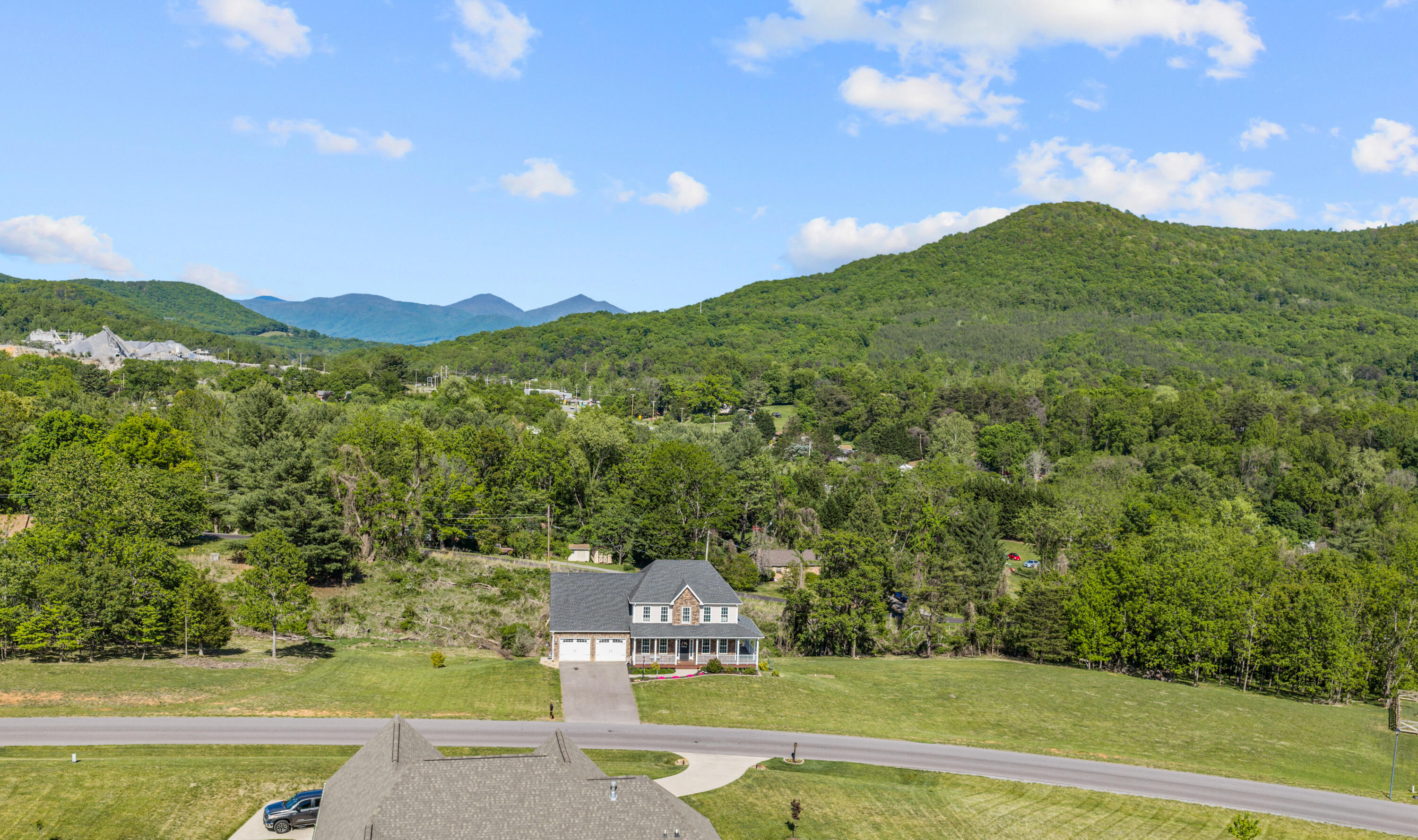 250 Thornblade Way Blue Ridge, VA 24064 - Photo 2 of 31 a view of a field with mountains in the background
