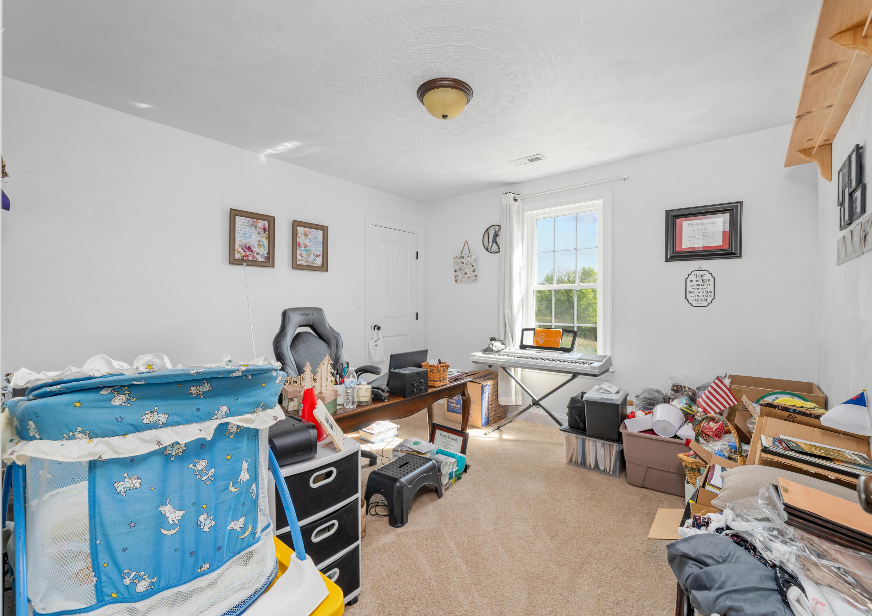 250 Thornblade Way Blue Ridge, VA 24064 - Photo 26 of 31 a living room with furniture gym equipment and a window