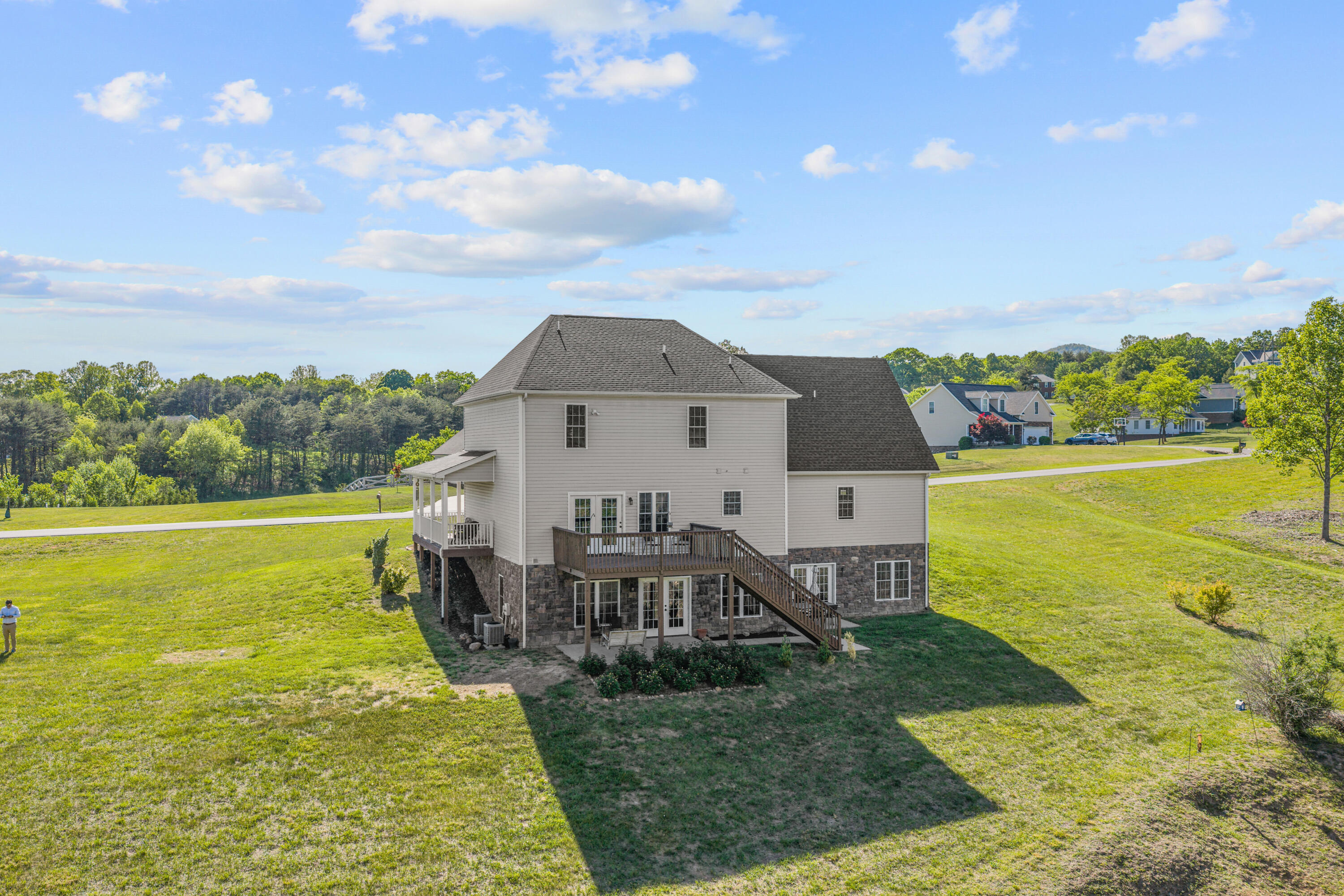 250 Thornblade Way Blue Ridge, VA 24064 - Photo 4 of 31 a view of a house with a garden and lake view