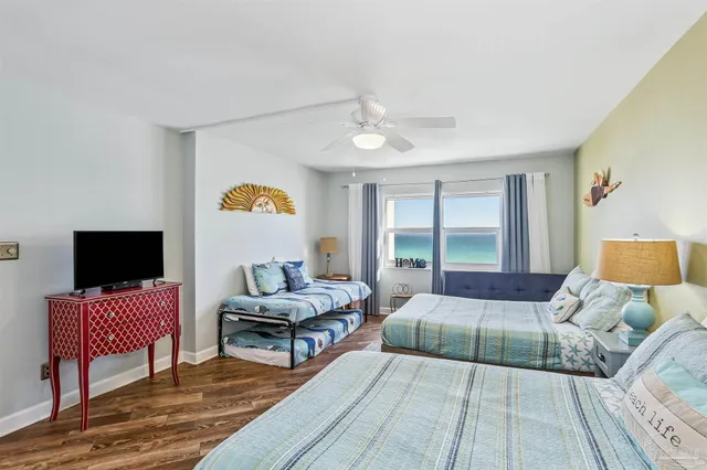 a bedroom with furniture and a flat screen tv