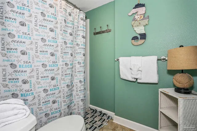 a bathroom with a toilet and a sink