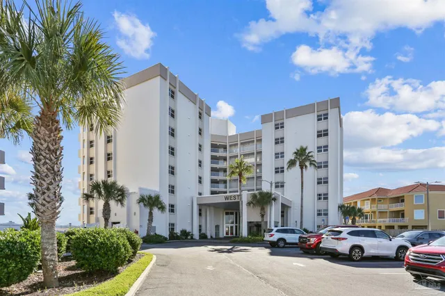 a city street lined with buildings and cars