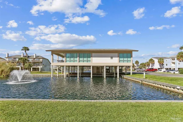 a view of a swimming pool with lawn chairs