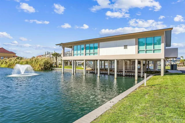 a view of a swimming pool with an outdoor seating