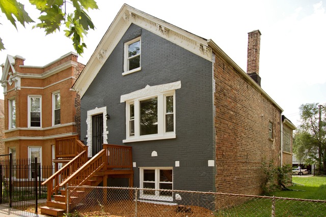 a front view of a house with parking