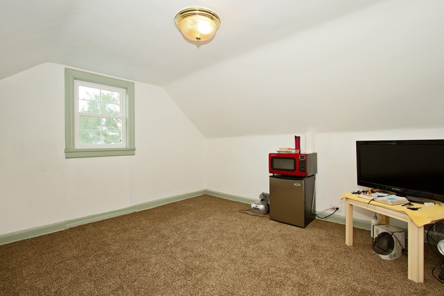 1512 South Springfield Avenue Chicago, IL 60623 - Photo 5 of 13 a room with furniture and flat screen tv