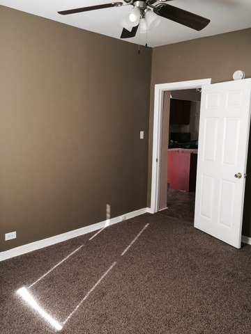 1512 South Springfield Avenue Chicago, IL 60623 - Photo 7 of 13 an empty room with a empty space