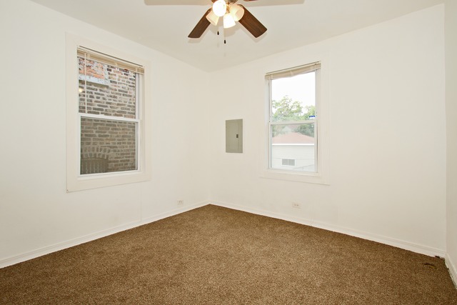 1512 South Springfield Avenue Chicago, IL 60623 - Photo 8 of 13 an empty room with a window