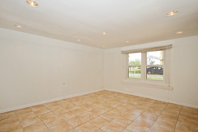 1512 South Springfield Avenue Chicago, IL 60623 - Photo 10 of 13 an empty room with a window