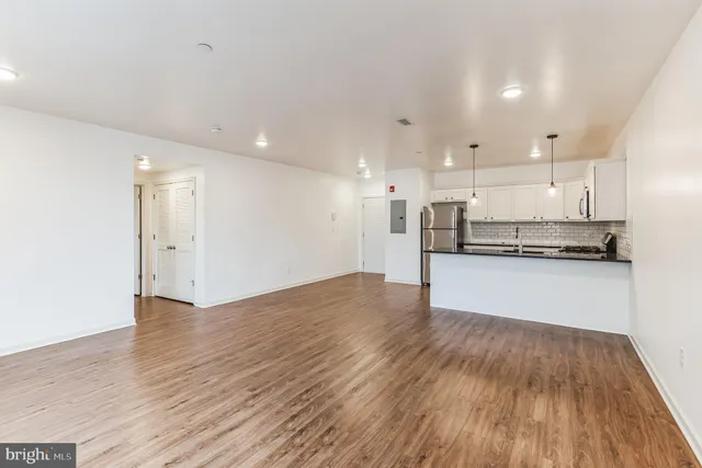 a view of kitchen with wooden floor