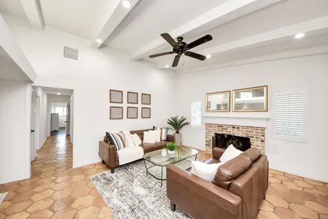 a living room with furniture or couch and a fireplace