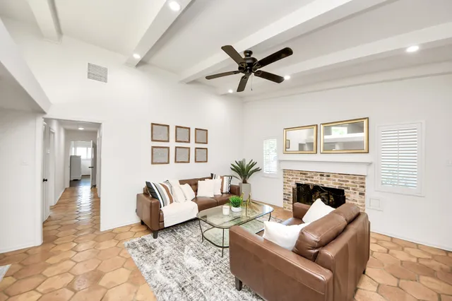 a living room with furniture or couch and a fireplace