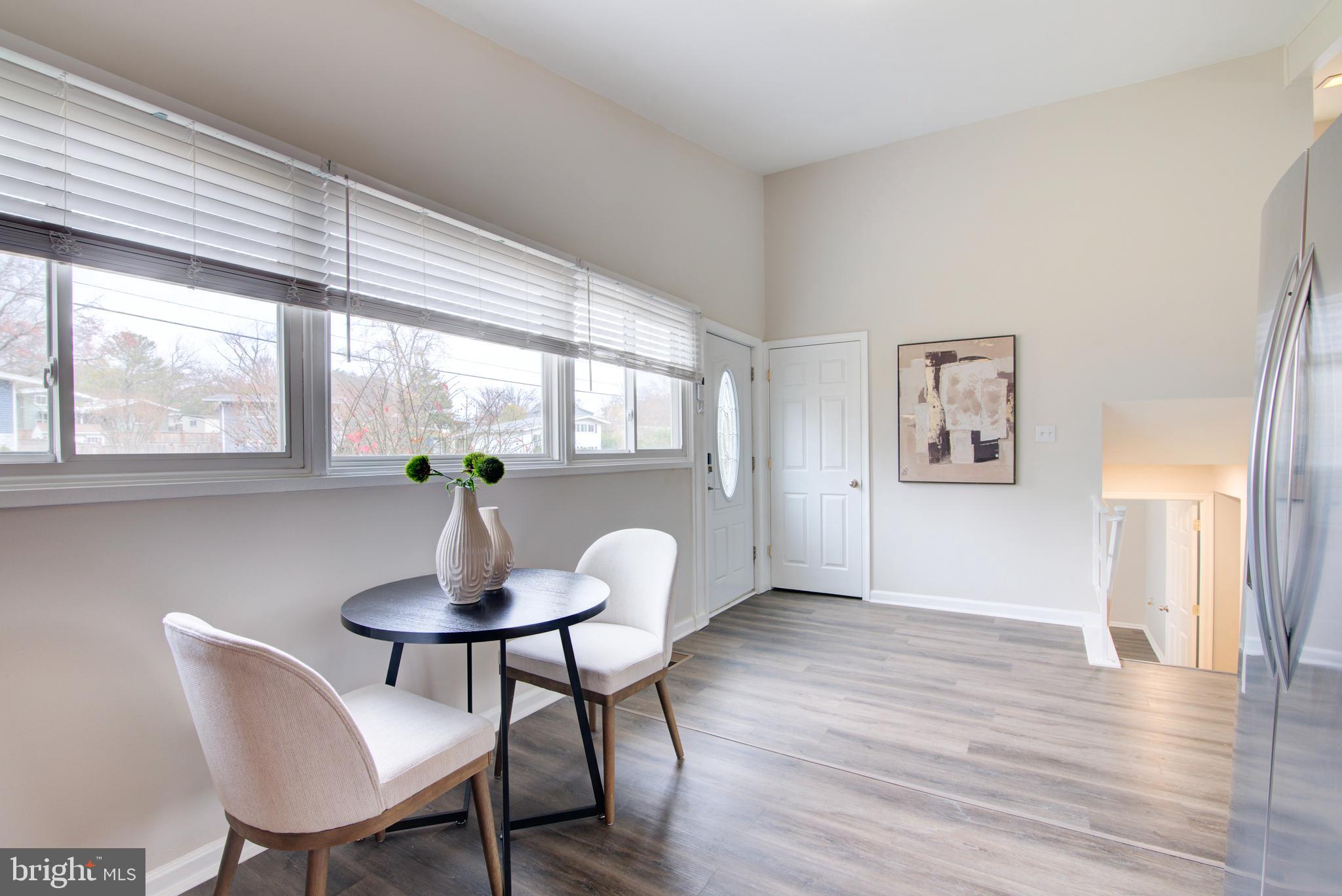 4103 Ivanhoe Lane Alexandria, VA 22310 - Photo 10 of 29 a view of a dining room with furniture window and wooden floor