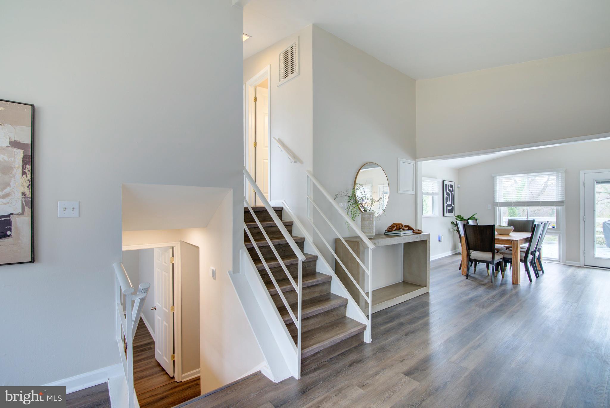 4103 Ivanhoe Lane Alexandria, VA 22310 - Photo 12 of 29 a view of living room and workspace with wooden floor