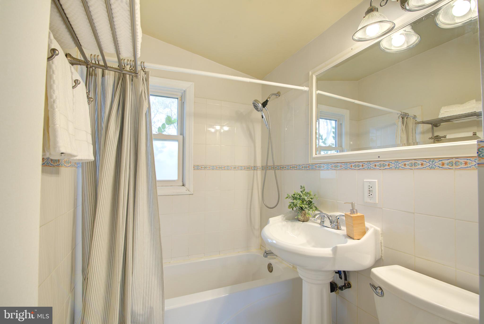 4103 Ivanhoe Lane Alexandria, VA 22310 - Photo 15 of 29 a bathroom with a sink a toilet and shower