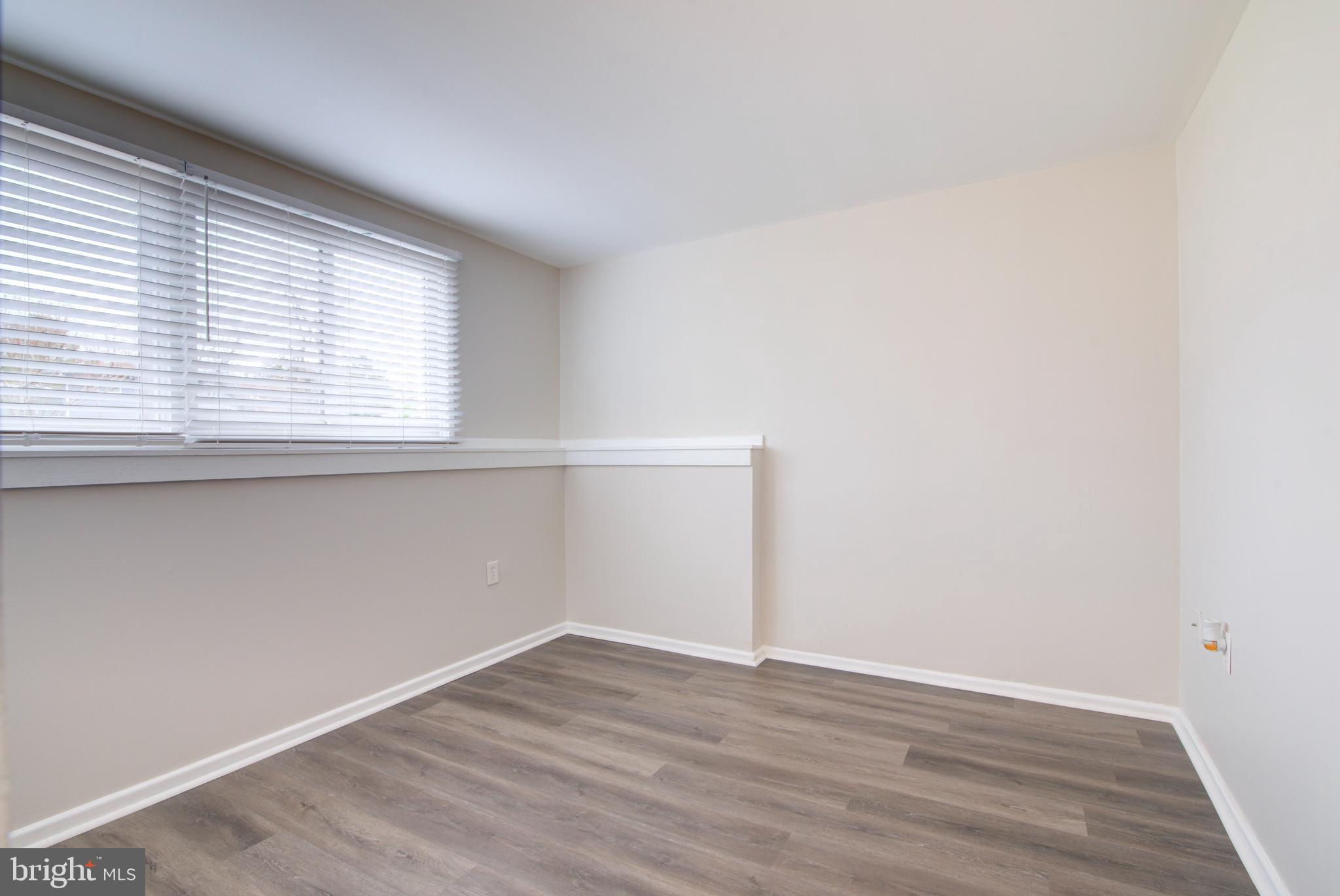4103 Ivanhoe Lane Alexandria, VA 22310 - Photo 17 of 29 an empty room with wooden floor and windows