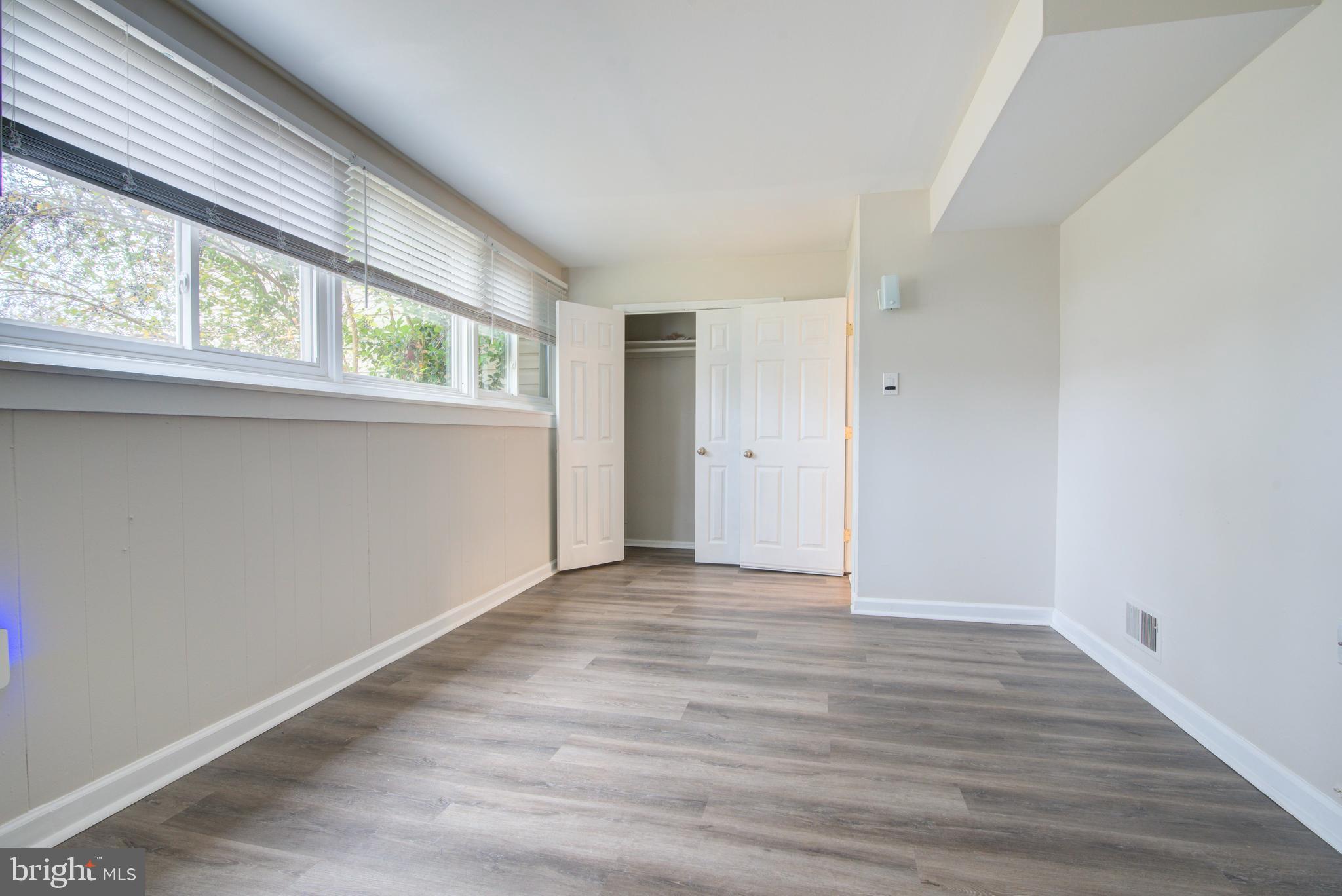 4103 Ivanhoe Lane Alexandria, VA 22310 - Photo 19 of 29 a view of an empty room with wooden floor and a window