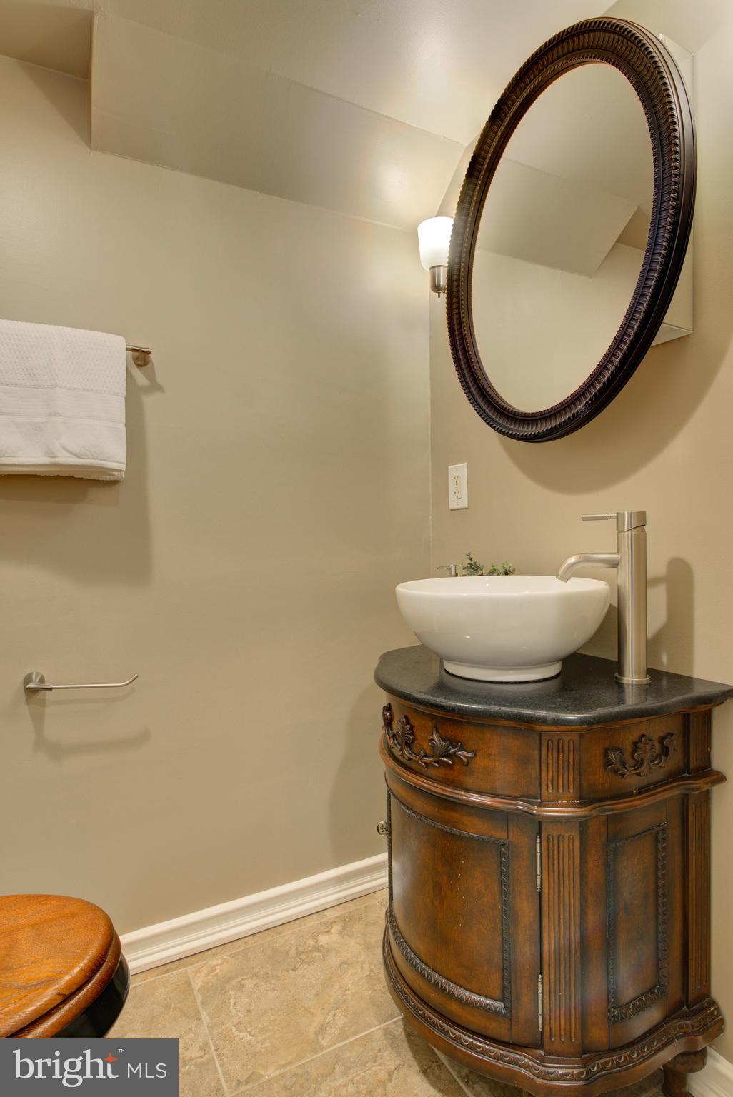 4103 Ivanhoe Lane Alexandria, VA 22310 - Photo 21 of 29 a bathroom with a sink and a mirror