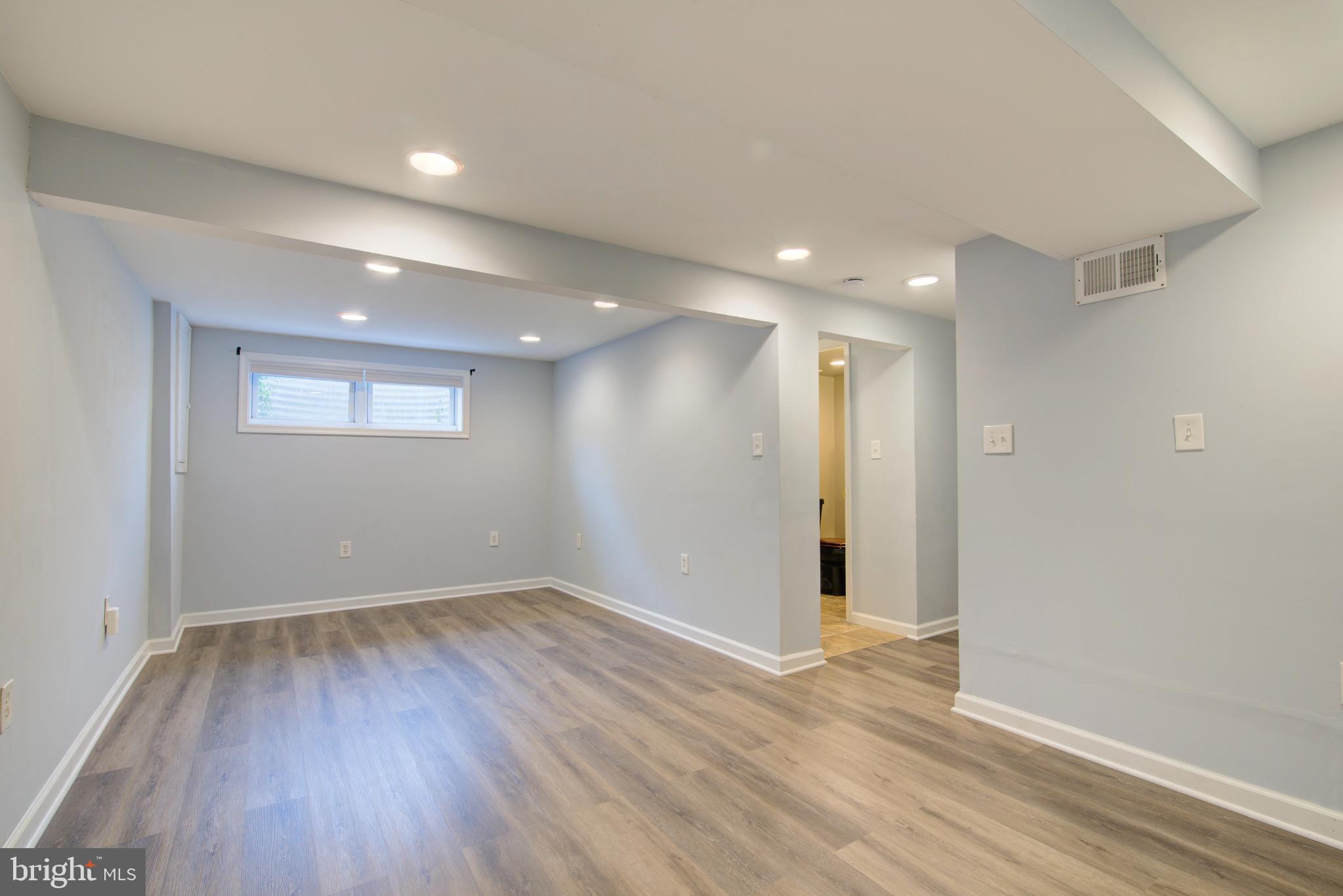 4103 Ivanhoe Lane Alexandria, VA 22310 - Photo 23 of 29 an empty room with wooden floor and windows