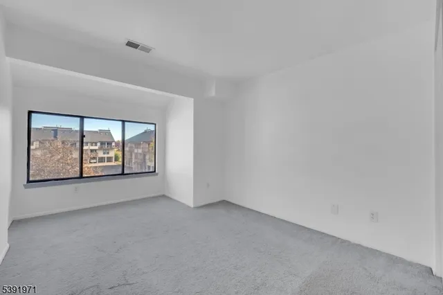 an empty room with closet area