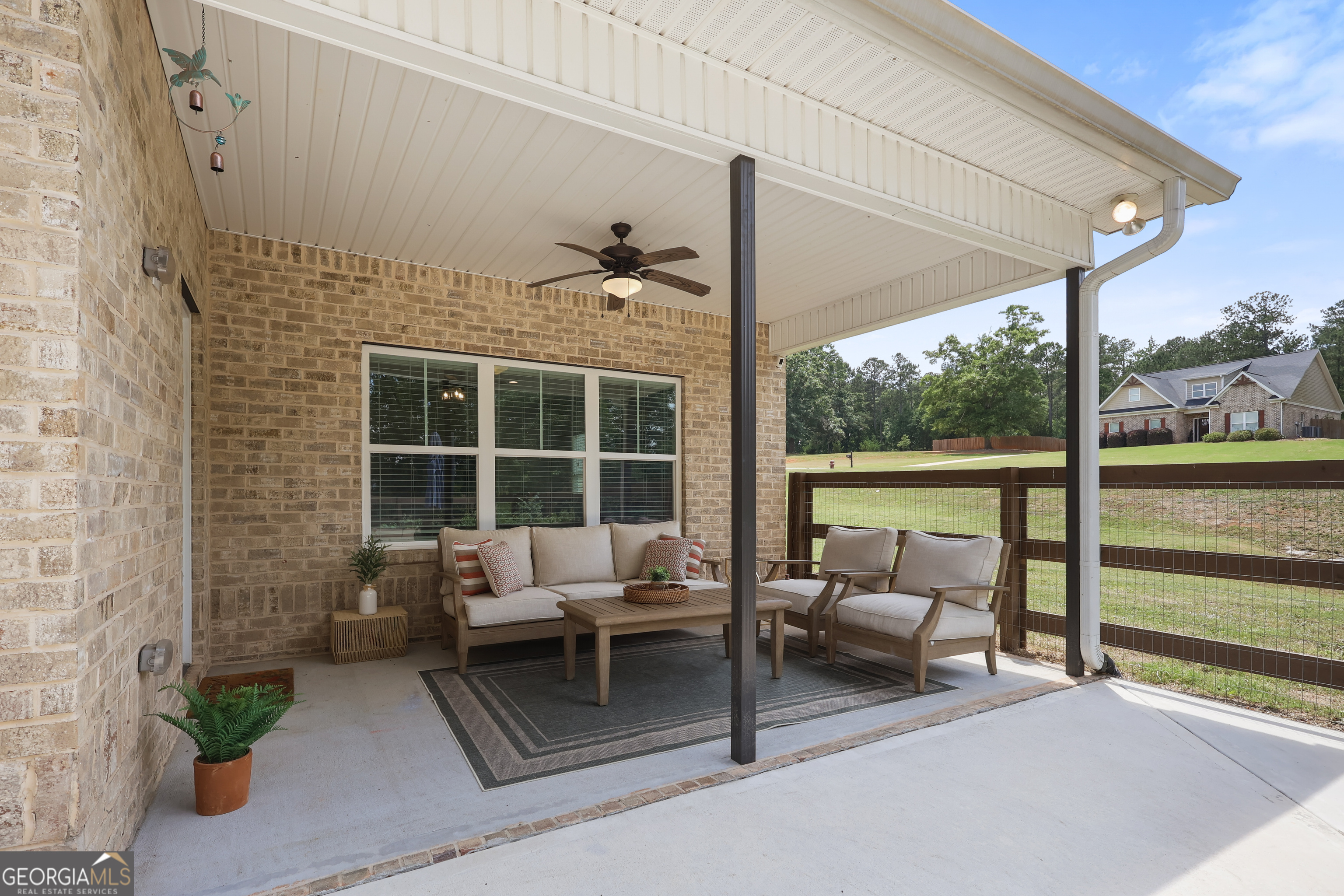 89 Claire Road Forsyth, GA 31029 - Photo 31 of 40 a balcony with furniture and a potted plant