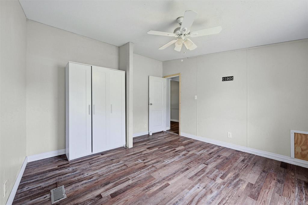 150 Gilbreath Road Sadler, TX 76264 - Photo 24 of 34 a view of an empty room with wooden floor