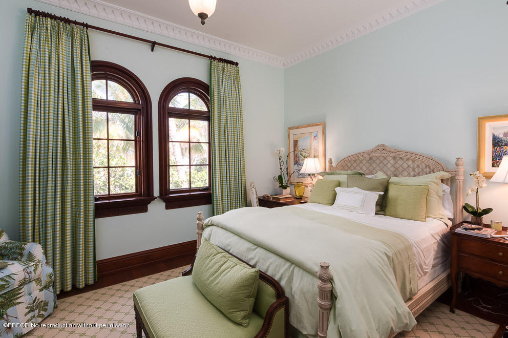 102 Gulfstream Road, Unit A Palm Beach, FL 33480 - Photo 11 of 17 a bedroom with a bed and a large window