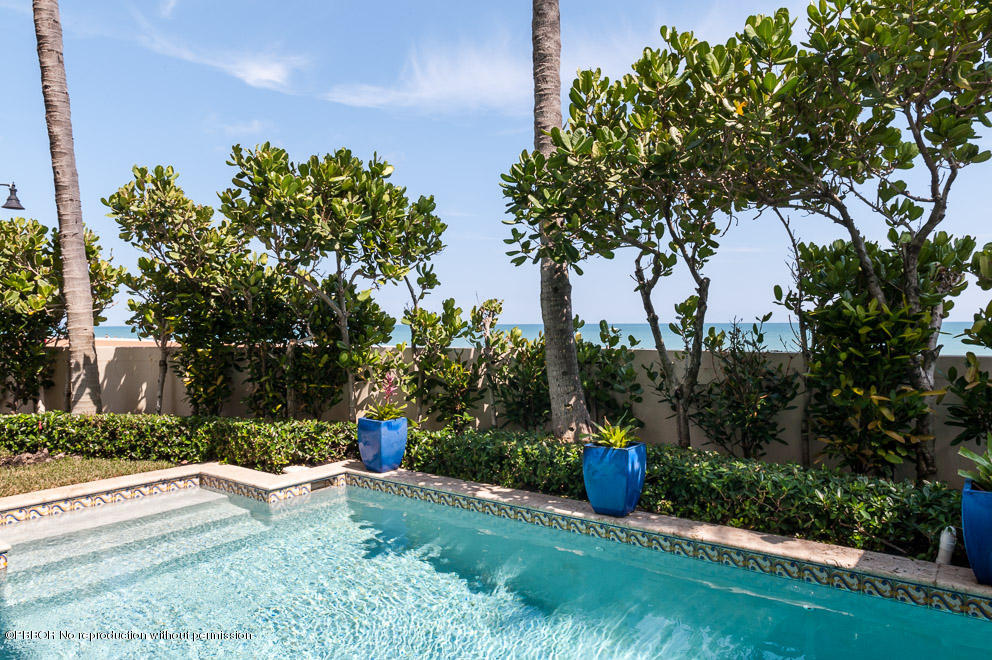 102 Gulfstream Road, Unit A Palm Beach, FL 33480 - Photo 15 of 17 a view of a fire pit with a fountain and a tree