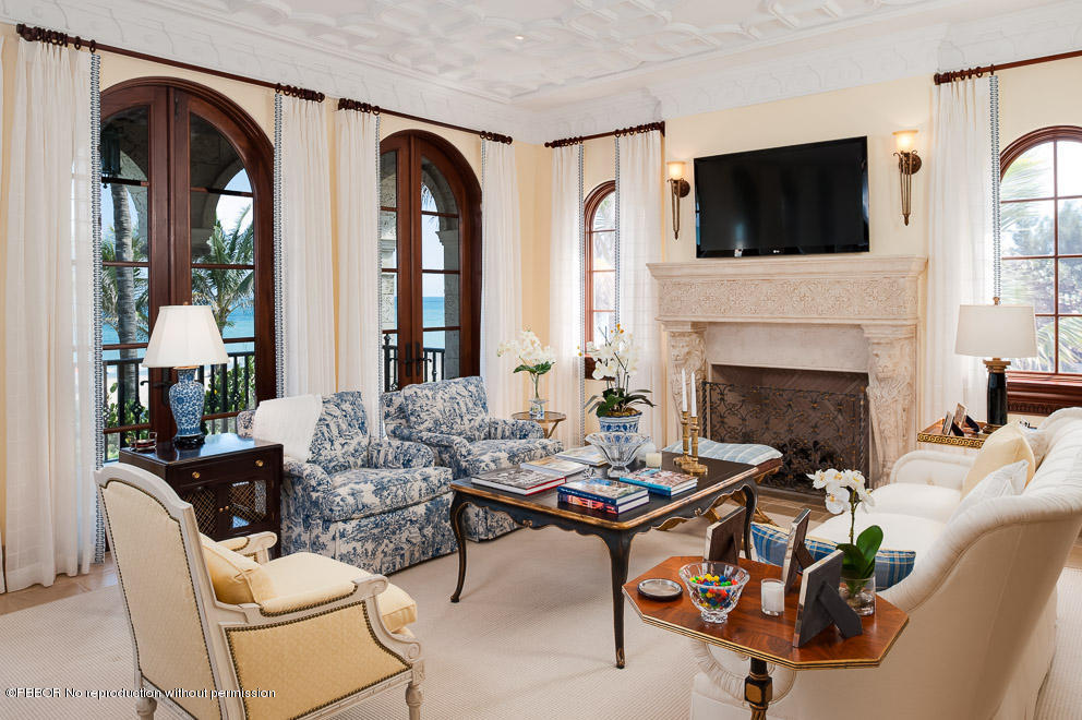 102 Gulfstream Road, Unit A Palm Beach, FL 33480 - Photo 4 of 17 a living room with furniture a fireplace and flat screen tv