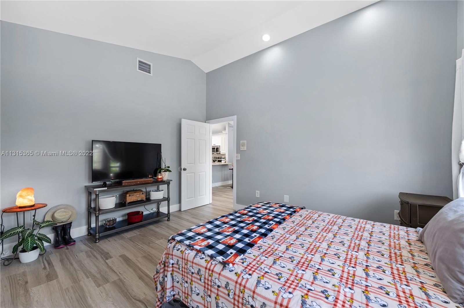 14626 Southwest 128th Court Road Miami, FL 33186 - Photo 13 of 24 a bedroom with a bed and a flat screen tv