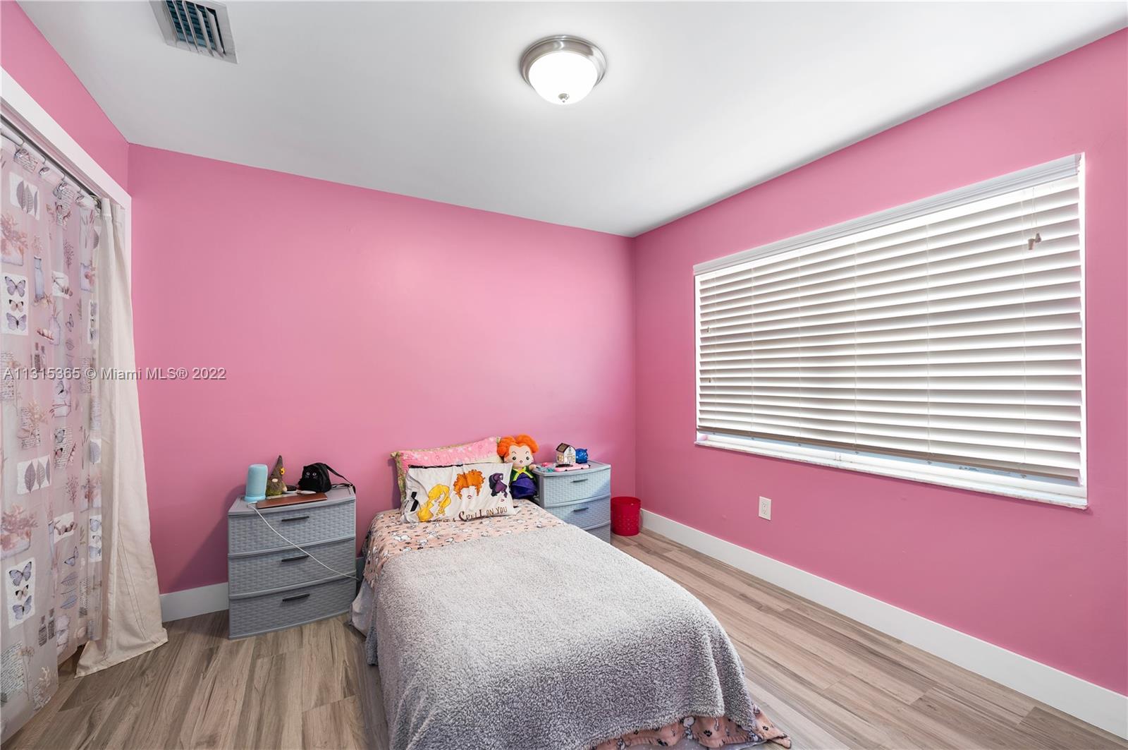 14626 Southwest 128th Court Road Miami, FL 33186 - Photo 15 of 24 a bed room with a bed and a window