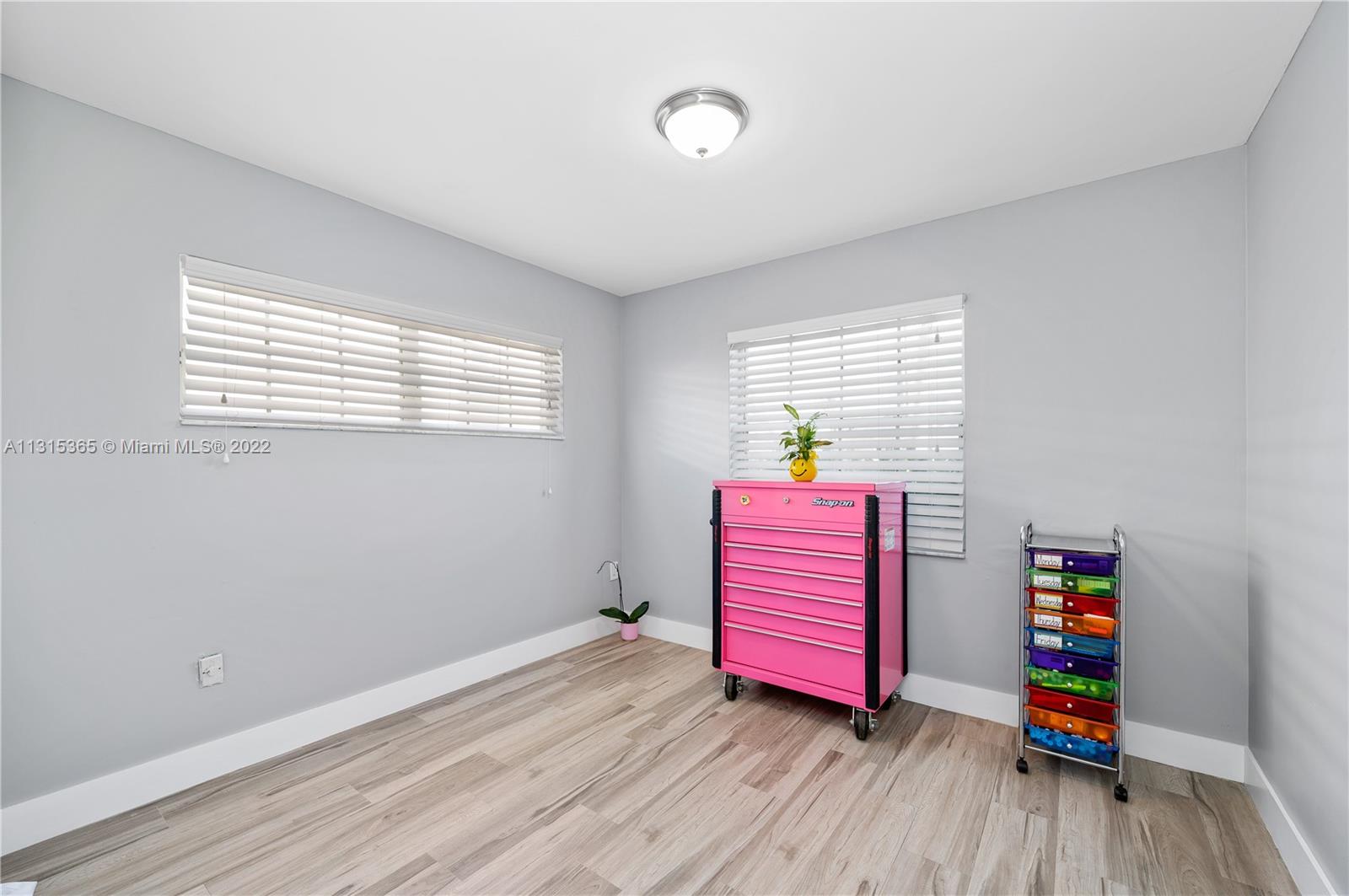 14626 Southwest 128th Court Road Miami, FL 33186 - Photo 17 of 24 a room with furniture and wooden floor