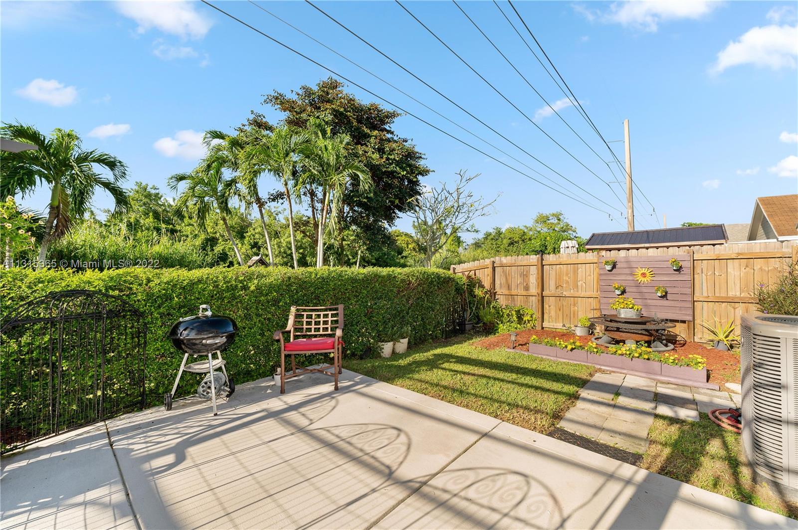 14626 Southwest 128th Court Road Miami, FL 33186 - Photo 22 of 24 a view of a backyard with sitting area