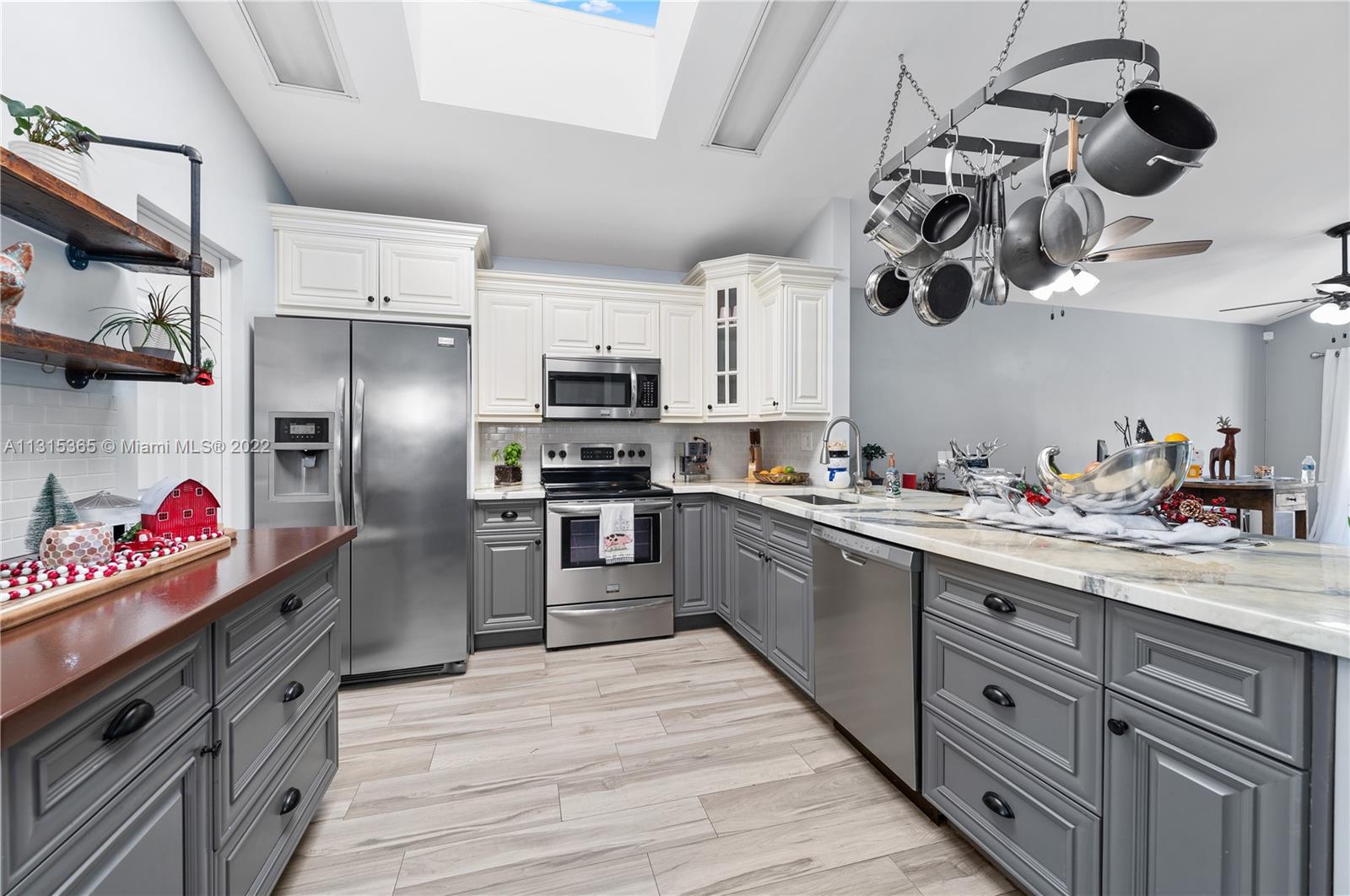 14626 Southwest 128th Court Road Miami, FL 33186 - Photo 6 of 24 a kitchen with stainless steel appliances granite countertop a sink a stove and refrigerator