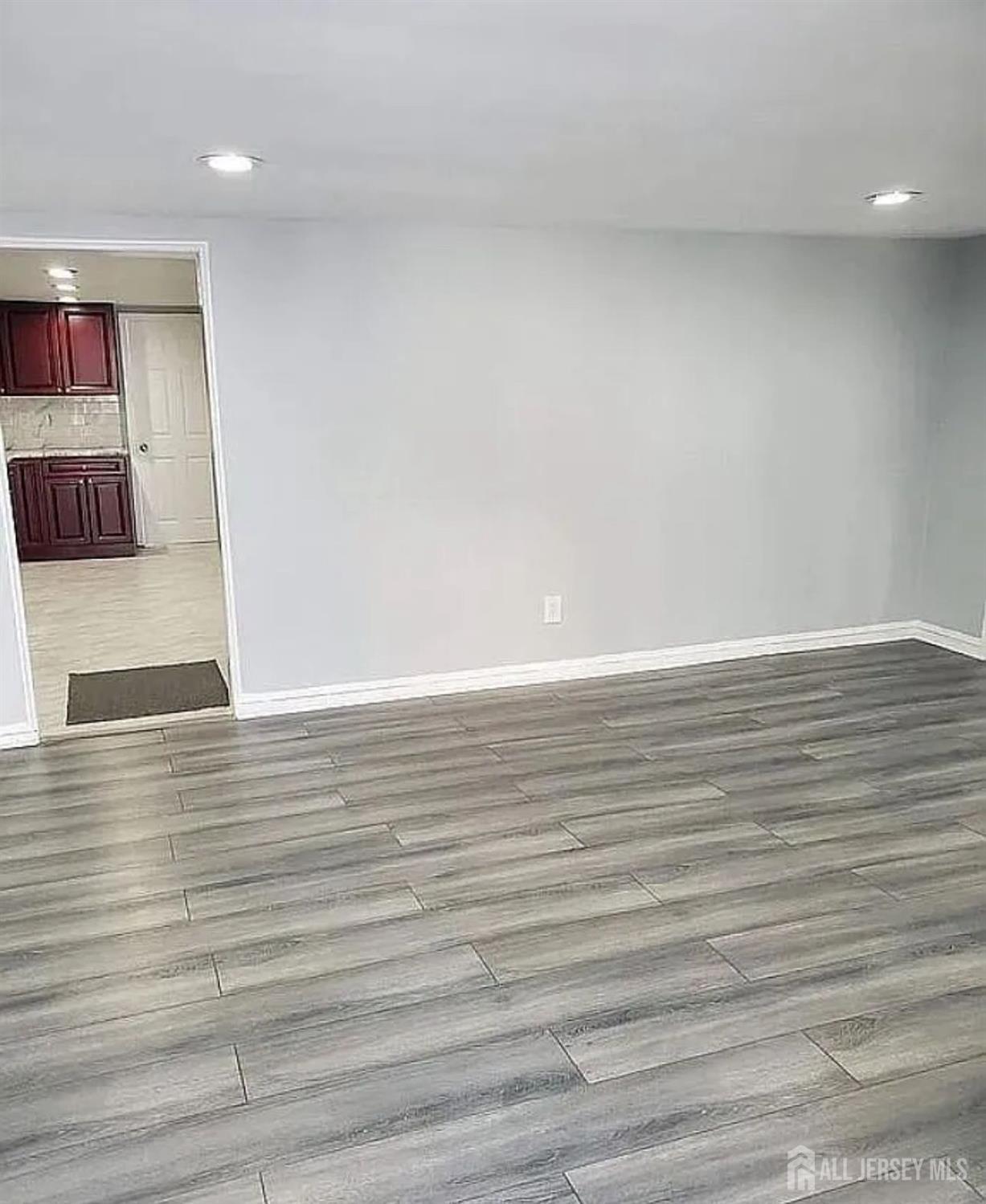 14-16 Kearney Street, Unit 14 Keyport, NJ 07735 - Photo 5 of 8 a view of room and wooden floor