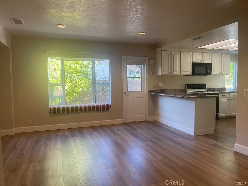 1246 Kinglake Drive Walnut, CA 91789 - Photo 2 of 9 a view of kitchen with wooden floor and electronic appliances