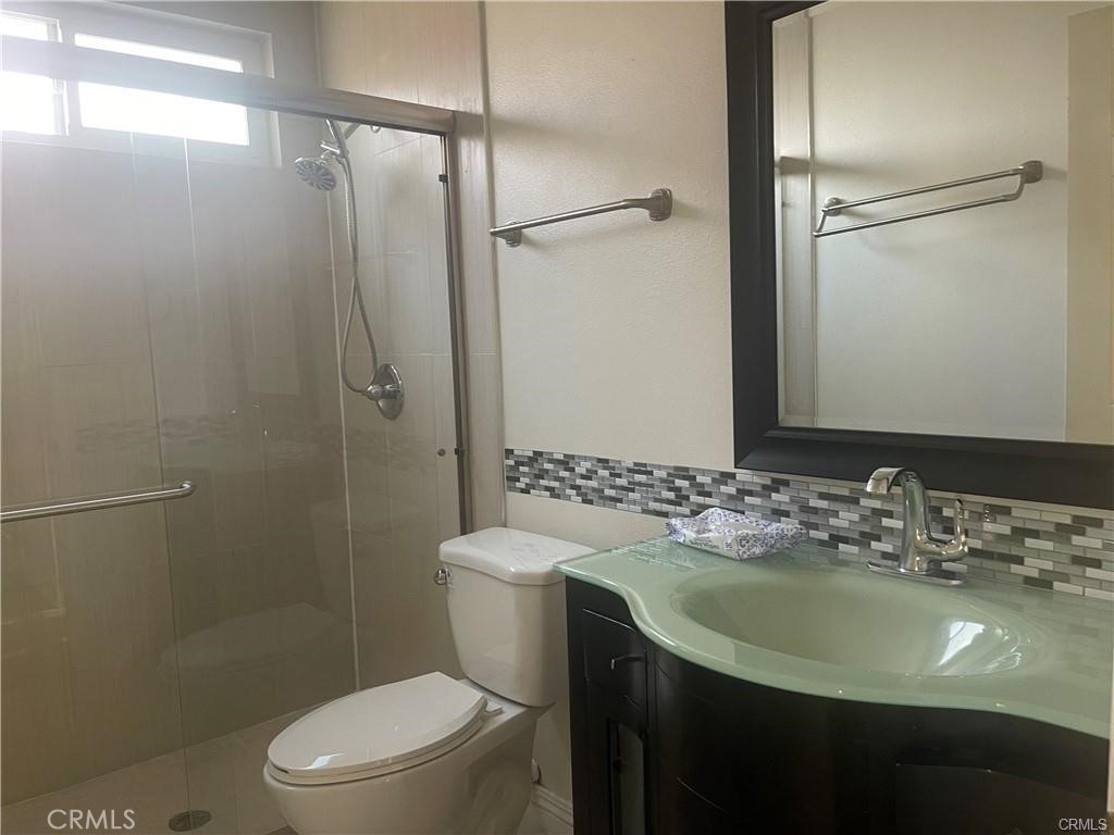 1246 Kinglake Drive Walnut, CA 91789 - Photo 7 of 9 a bathroom with a sink toilet and shower