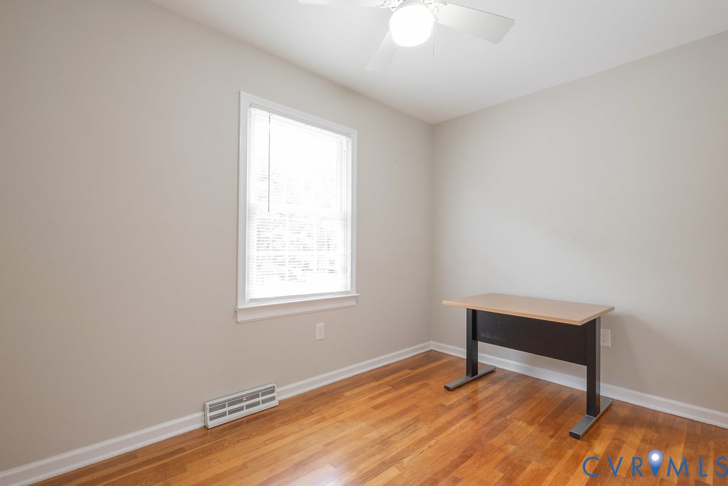 6901 Manning Road Chesterfield, VA 23832 - Photo 49 of 57 Room featuring wood-finish flooring, a window with