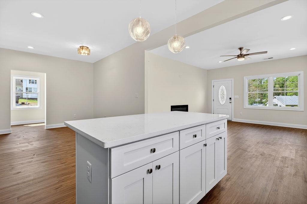 1303 East Main Street Waynesboro, VA 22980 - Photo 15 of 38 a kitchen with a wooden floor and window