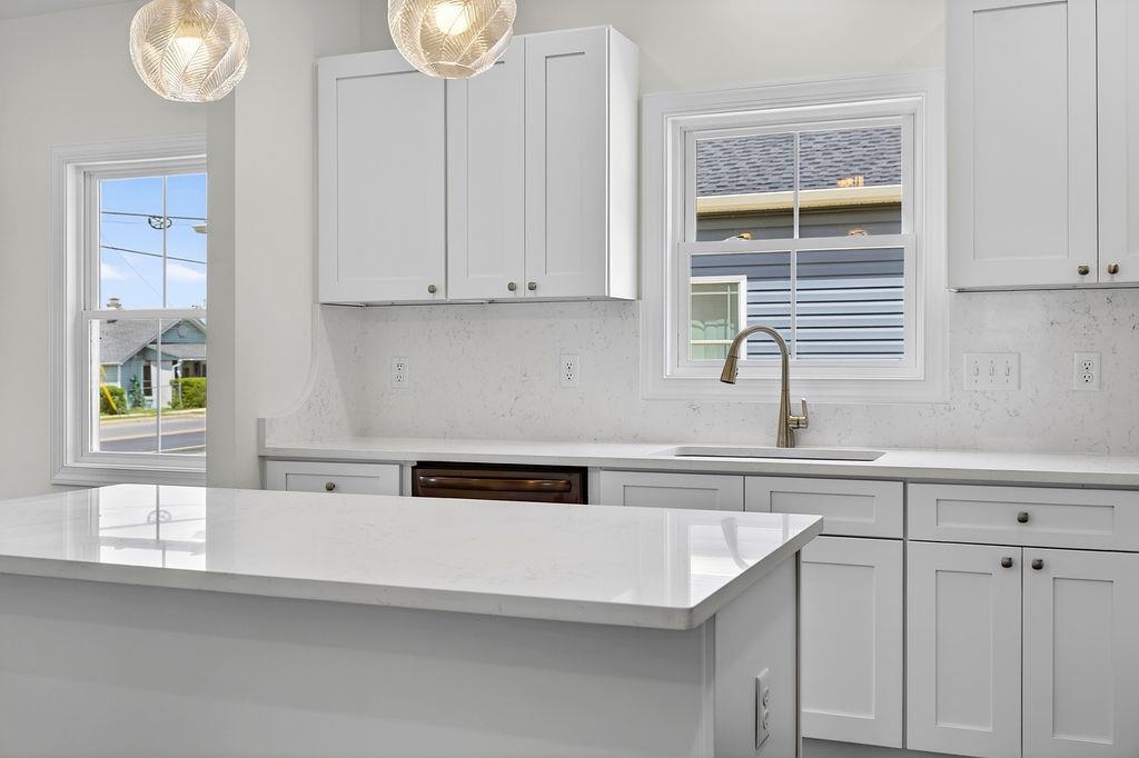 1303 East Main Street Waynesboro, VA 22980 - Photo 16 of 38 a kitchen with a sink and cabinets