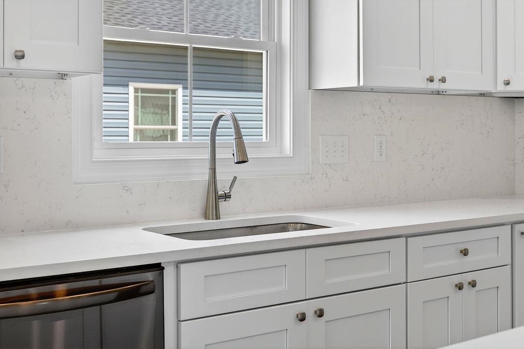 1303 East Main Street Waynesboro, VA 22980 - Photo 21 of 38 a kitchen with a sink and cabinets