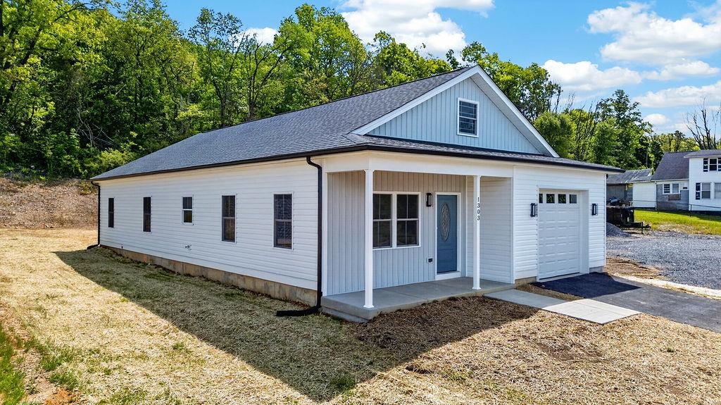 1303 East Main Street Waynesboro, VA 22980 - Photo 26 of 38 a front view of a house with a yard